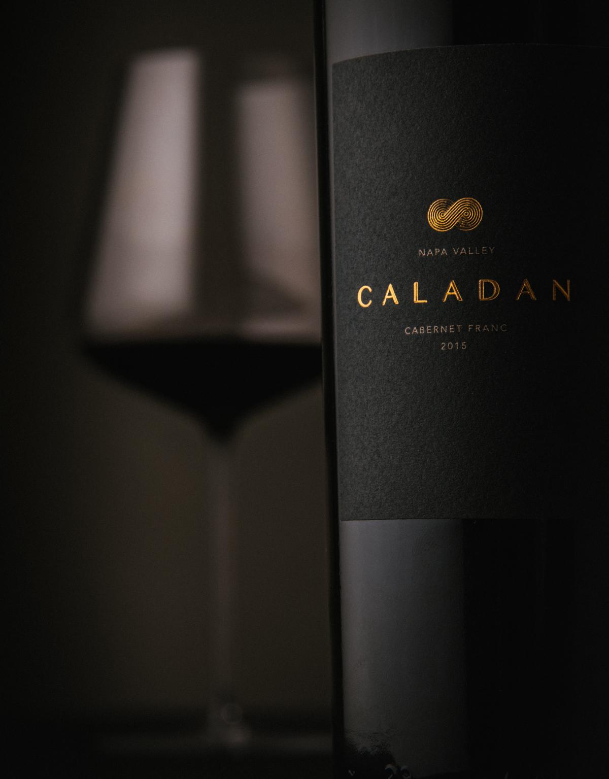 Caladan 2015 Cabernet Franc wine bottle with glass in distance